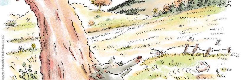 Loup gris dormant sous un arbre